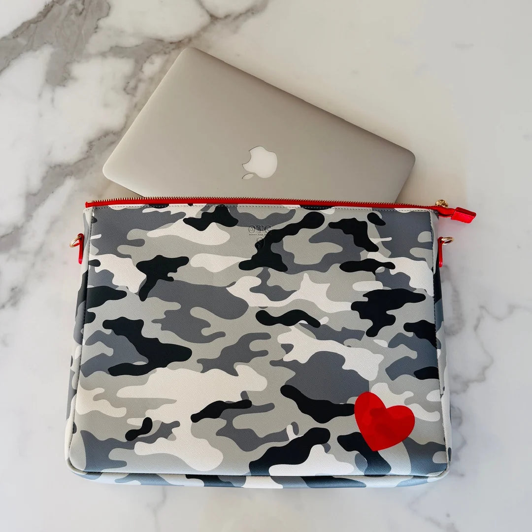 Grey camo #9 Abby Camo Love padded techie crossbody holding a laptop on marble